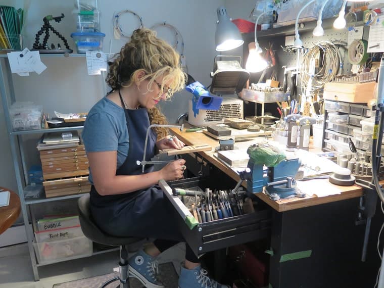 Christina Zefis at her jewelry workbench